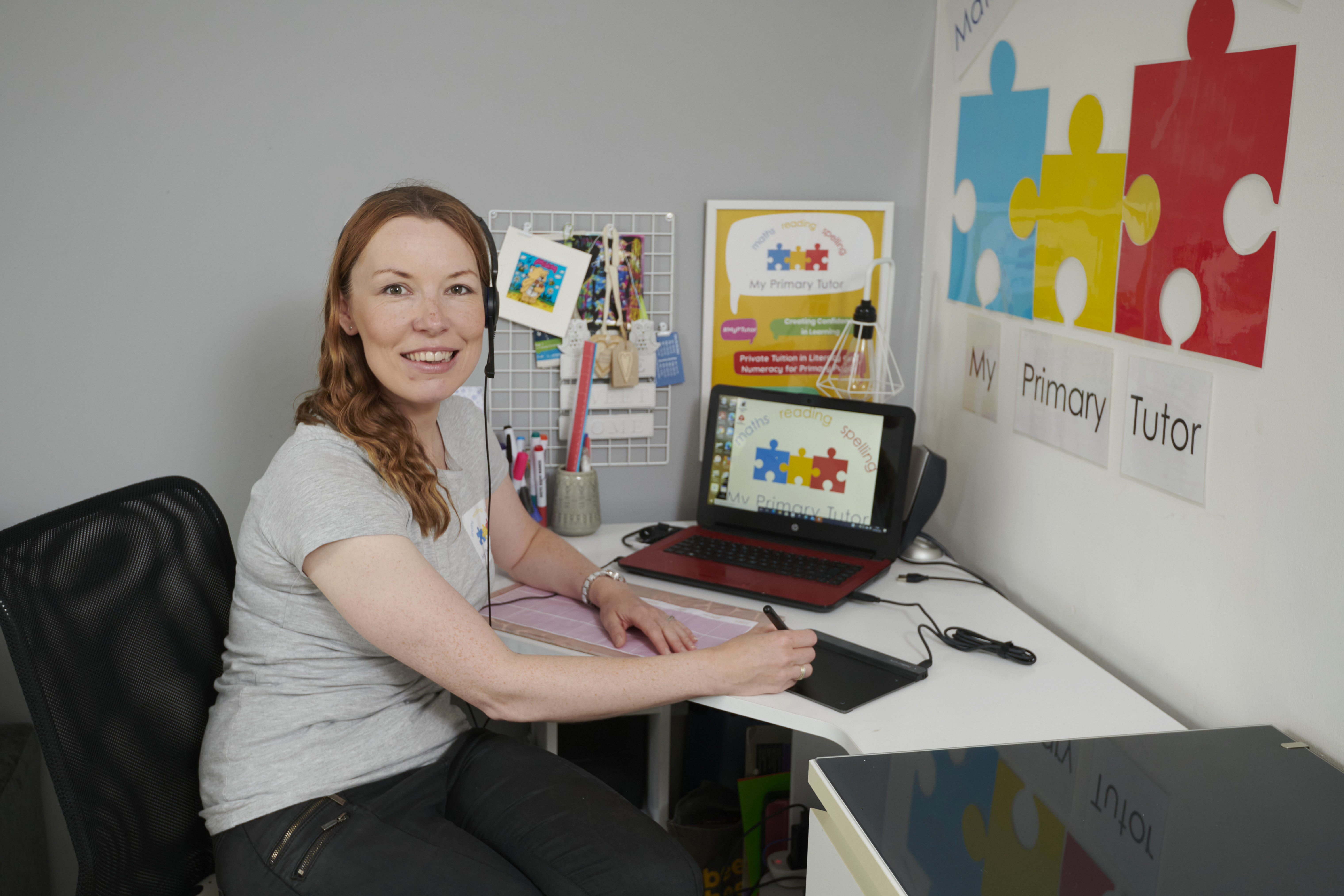 Karen Simpson of My Primary tutor sitting in front of computer 